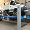 4-pillar lift checks the angle of 4-ton wheel placement